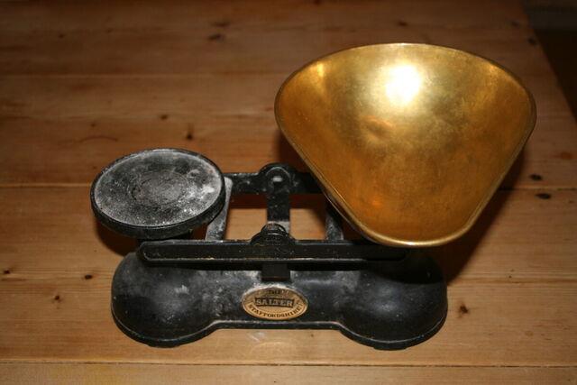 Old cast-iron kitchen scales with a brass pan